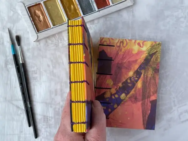 Coptic book with yellow abstract cover and yellow spine