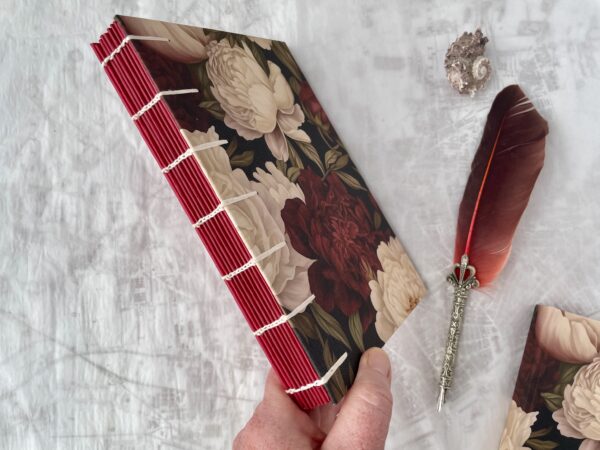 Red and white rose diaries showing coptic spine